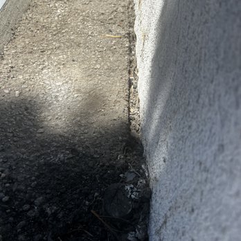 City Plumbing and Rooter - The original asphalt and the gap between the asphalt and the cinderblock wall remains and not covered by a concrete slope. - Plumbing Near Me - Winnetka, California City Plumbing and Rooter - The original asphalt and the gap between the asphalt and the cinderblock wall remains and not covered by a concrete slope. - Plumbing Near Me - Winnetka, California