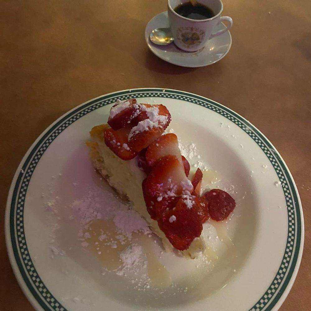 Casa Dora Italian Cafe - Angie's homemade cheesecake with white chocolate sauce and strawberry's. And of course espresso. - Italian Near Me - Jacksonville, Florida Casa Dora Italian Cafe - Angie's homemade cheesecake with white chocolate sauce and strawberry's. And of course espresso. - Italian Near Me - Jacksonville, Florida