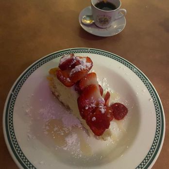 Casa Dora Italian Cafe - Angie's homemade cheesecake with white chocolate sauce and strawberry's. And of course espresso. - Italian Near Me - Jacksonville, Florida Casa Dora Italian Cafe - Angie's homemade cheesecake with white chocolate sauce and strawberry's. And of course espresso. - Italian Near Me - Jacksonville, Florida