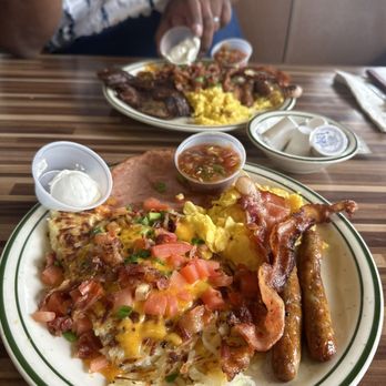 NORMS - Loaded hash browns with bacon eggs ham and sausage - Diners Near Me - Van Nuys, California