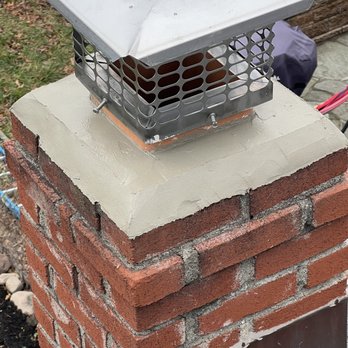 Heavenly Construction - The entire chimney crown has been completely rebuilt with fresh mortar. - Roofing Near Me - Paterson, New Jersey