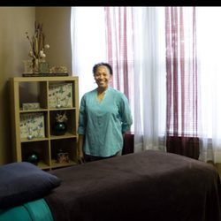 Serenity Works - Vanessa in her massage room. Experience a place or peace, joy, healing, and restoration.