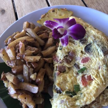 Barefoot Beach Cafe - This was my vegetarian omelet.Well presented.The potatoes were not crispy, a little soggy really, but tasty. Need salsa for the eggs. - Breakfast & Brunch Near Me - Honolulu, Hawaii