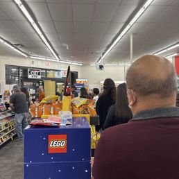 You have 20 people waiting in line and a few people press the help button to open different glass cabinets.