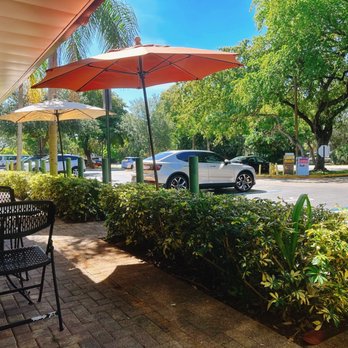 Commercial Point Cafe - a car parked in the parking lot - American Near Me - Fort Lauderdale, Florida