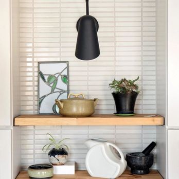 ConnStruct - a shelf with pots and a lamp - General Contractors Near Me ConnStruct - a shelf with pots and a lamp - General Contractors Near Me