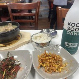 Traditional soondae (pork blood sausage with glass noodles) and makgeoli (rice wine) Traditional soondae (pork blood sausage with glass noodles) and makgeoli (rice wine)