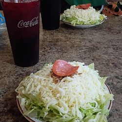 Pizza Glen - Salad with ranch dressing. The ranch is on top of the lettuce under the mound of cheese.