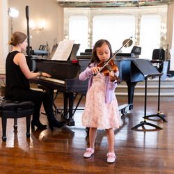 Community Music School - A young violinist performs during a CMS recital.