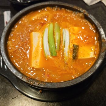 Kimchi House - a bowl of kimchi soup on a table - Korean Near Me - Toronto, Ontario
