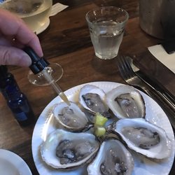 Port City Royal - Oysters came with droppers of house made ... sauces...