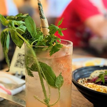 Miss Ada - a tall glass of a drink with a straw and a sprig of mint - Mediterranean Near Me - Brooklyn, New York Miss Ada - a tall glass of a drink with a straw and a sprig of mint - Mediterranean Near Me - Brooklyn, New York