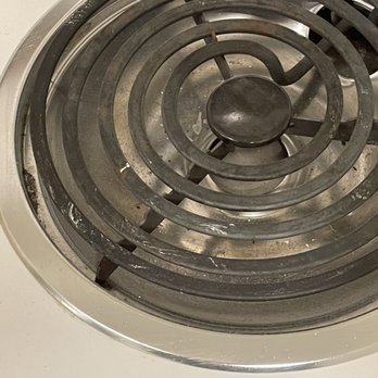 Empire Pro Painters - Paint on stove burner - Painters Near Me