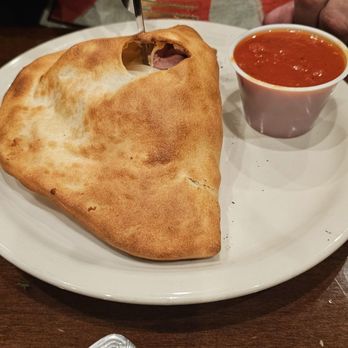 Giovanni's Pizzeria & Kitchen - Special calzone - Italian Near Me - Oviedo, Florida Giovanni's Pizzeria & Kitchen - Special calzone - Italian Near Me - Oviedo, Florida