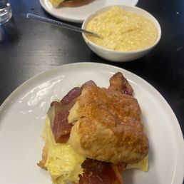 Bacon egg and cheese biscuit, cheese grits, sausage egg and cheese on brioche bun