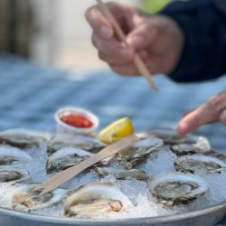 Roy Moore Lobster - dozen oysters from Roy Moore being enjoyed on their outdoor back deck.