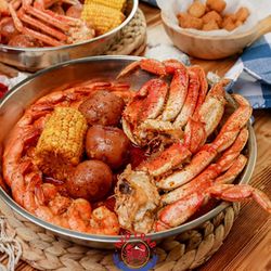 Red Crab Juicy Seafood - Crab legs, shrimp, corn & potatoes in bold Cajun sauce -- this pan has it ALL! Come get yours today!