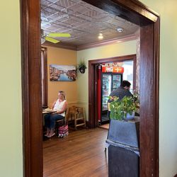 Puccio's New York Deli - Front door leads to the entryway seating, deli counter is in the back.  Walk through to the back to order.