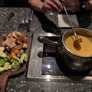Photo of The Melting Pot - Buffalo, NY, United States. Wisconsin cheese fondue with unlimited refill dip tray