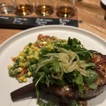 Whiskey Cake Alliance - BONE-IN PORK CHOP* / 27 Guten Free sweet corn-edamame succotash, shaved apple, pea tendrils, apple cider-mustard seed glaze - New American Near Me - Fort Worth, Texas Whiskey Cake Alliance - BONE-IN PORK CHOP* / 27 Guten Free sweet corn-edamame succotash, shaved apple, pea tendrils, apple cider-mustard seed glaze - New American Near Me - Fort Worth, Texas