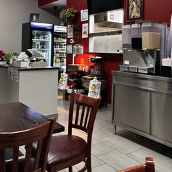 Taqueria Aurora Burlington - Small seating area. A few tables. Maybe 6.