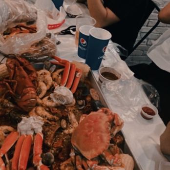 Kickin Kajun - Snow Crab Legs Combo (in the back), Six pound seafood tray piled high with everything a seafood lover could dream of. - Cajun/Creole Near Me - Honolulu, Hawaii