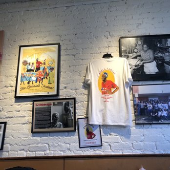 Casa Adela - Walls with pictures of Doña Adela - Latin American Near Me - New York, New York