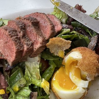 Dashi - Beef salad is served with a fried soft boiled egg - Food Trucks Near Me - North Charleston, South Carolina