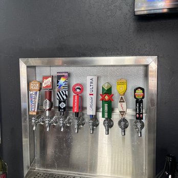 Zzeeks Pizza - a row of beer taps - Pizza Near Me - Tempe, Arizona