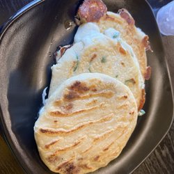 Bean and cheese pupusa, cheese and japapeno pupusa and a zucchini and cheese pupusa.
