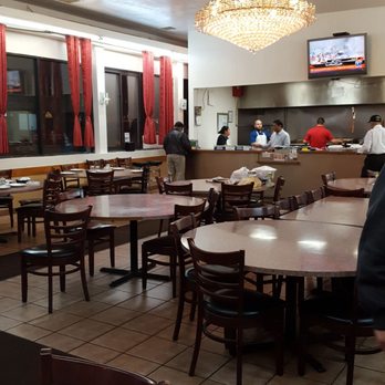Khan BBQ - casual dining room with juxtaposed fancy chandelier :) - Barbeque Near Me - Chicago, Illinois