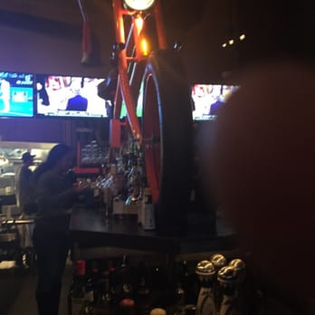 OHSO Distillery - Big fake bike in middle of bar wrecks TV view. - New American Near Me - Scottsdale, Arizona OHSO Distillery - Big fake bike in middle of bar wrecks TV view. - New American Near Me - Scottsdale, Arizona