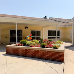 Cadia Healthcare - Residents and staff at Cadia Rehabilitation Capitol tend this courtyard garden together -- a favorite spot to relax outdoors.