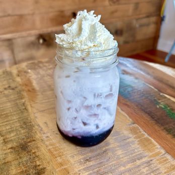 Solid Coffee - Blueberry Italian Soda.  Made with blueberry syrup, seltzer, cream and home made vanilla whipped cream. - Coffee & Tea Near Me - Hoquiam, Washington