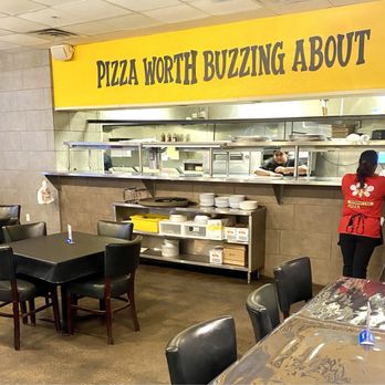 Pizza Buzz - Kitchen overlooks dining room. - Pizza Near Me - Watauga, Texas Pizza Buzz - Kitchen overlooks dining room. - Pizza Near Me - Watauga, Texas