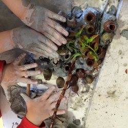 Wildwood Children's School - Making a sculpture with clay and natural materials.