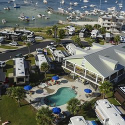 Pensacola Beach Rv Resort - Clubhouse and pool surrounded by the Deluxe sites.