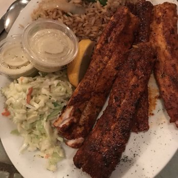The Smiling Fish - a plate of food with rice and coleslaw - Fish & Chips Near Me - St. Catharines, Ontario