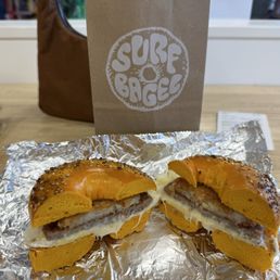 sausage, egg, cheese with a hash brown on an everything egg bagel sausage, egg, cheese with a hash brown on an everything egg bagel