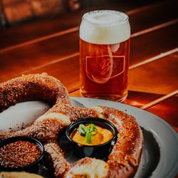 Brewlando Sanford - Bavarian pretzel with beer cheese and mustard paired with a Brewlando brew at Brewlando Sanford, a brewery and restaurant in ...