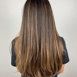 Trinity Hill Salon - Caramel balayage beautifully brightens up this chocolate brown hair.