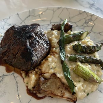 Cítricos - Oak-grilled Filet Mignon* With aged cheddar grits, seasonal vegetables and beef jus - New American Near Me - Lake Buena Vista, Florida Cítricos - Oak-grilled Filet Mignon* With aged cheddar grits, seasonal vegetables and beef jus - New American Near Me - Lake Buena Vista, Florida