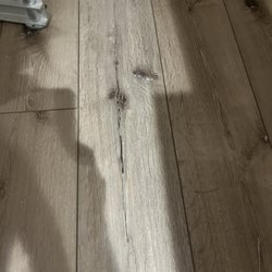 Republic Floor - Huge cracks called "etching" a Q-tip fits in these cracks that are part of the design I'm being told. Horrible.