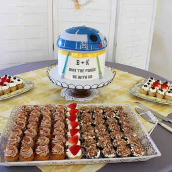 Simply Sweet Cakery - R2D2 wedding cake with mini cupcakes courtesy of Simply Sweet Cakery. - Bakeries Near Me - Costa Mesa, California Simply Sweet Cakery - R2D2 wedding cake with mini cupcakes courtesy of Simply Sweet Cakery. - Bakeries Near Me - Costa Mesa, California