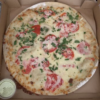 The Cheeseboard Collective - Fresh Tomato Pizza with cilantro buttermilk ranch - Bakeries Near Me - Berkeley, California