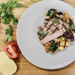 Bountiful - Grilled Pork Chop With White Beans, Kale, Tomato, and Polenta