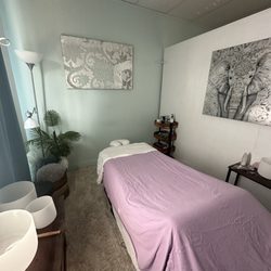 Divine Moon Wellness - Massage table and sound bowls