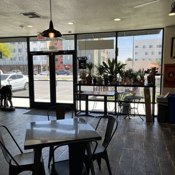 Buddha’s Brew Coffee Cafe - Front door area with Plant shelf - Coffee & Tea Near Me - Mesa, Arizona