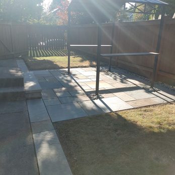 Pacific Fern Designs - Widened the existing walkway with more bluesstone to extend beyond the patio. - Gardeners Near Me