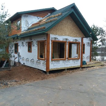 Troy Griffin Construction - Prepping for Scanlog hand hewn siding. - General Contractors Near Me - Gordon, Wisconsin Troy Griffin Construction - Prepping for Scanlog hand hewn siding. - General Contractors Near Me - Gordon, Wisconsin